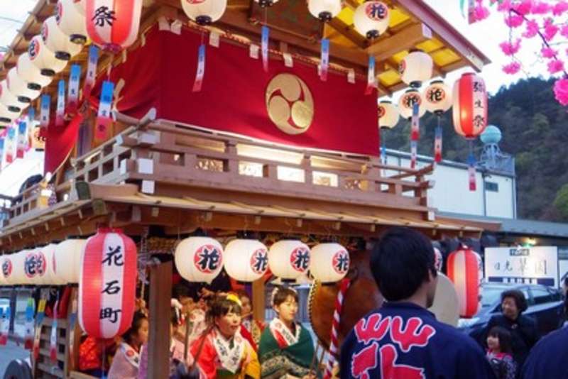 Portable shrines are decorated extravagantly and paraded to the sound of festival music