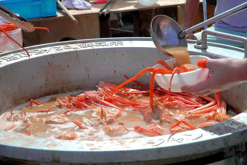 large hot pots of crab soup