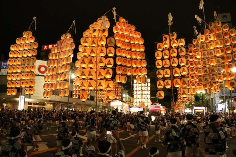 Warmly colored bamboo lanterns light up the streets at night