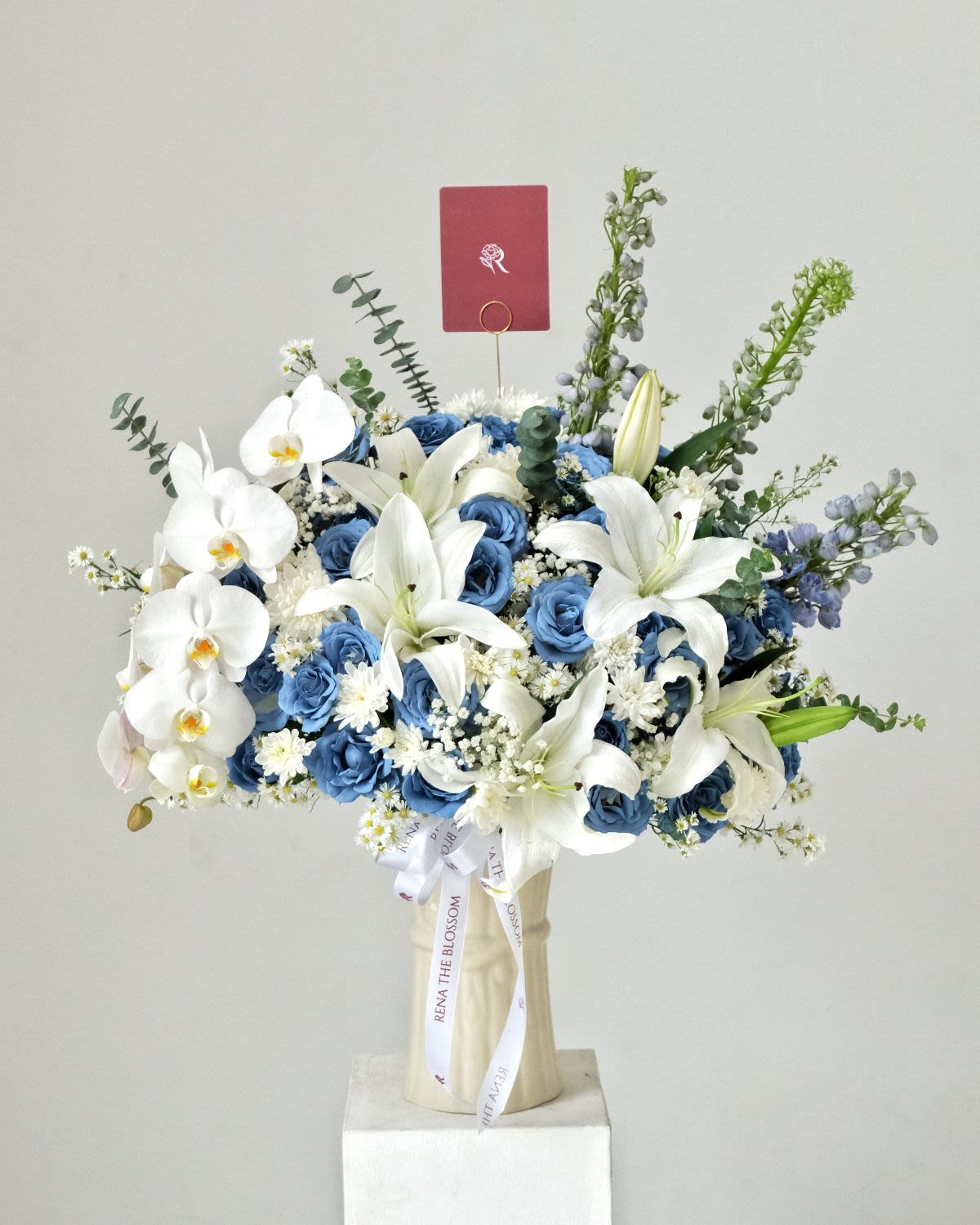Blooming Lily Vase - White aster, blue roses & cascade orchid with lily — blooming toward light. - Rena The Blossom Jakarta