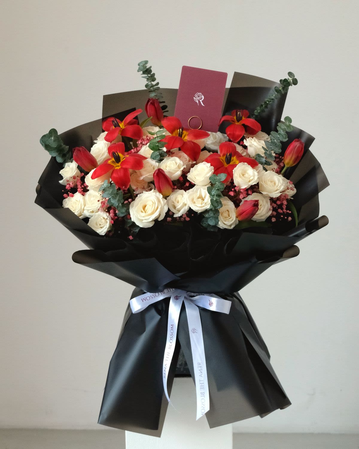 Rubescent - White roses & red tulips with silver dollar — glowing rubescent warmth. - Rena The Blossom Jakarta