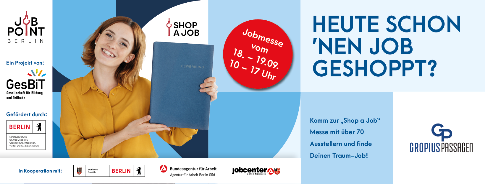 Man sieht das blaue Werbedesign für unsere "Shop a Job"-Messe in den Gropius Passagen.
