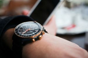 checking time on watch