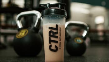 a shaker with a pink liquid in it