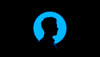 a silhouette of a person in front of a blue circle