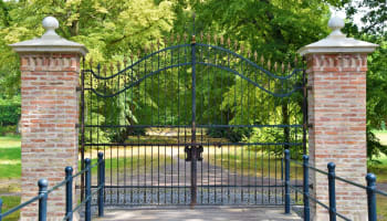 a gate with trees in the background