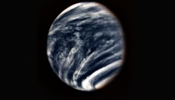 a planet with clouds in the sky