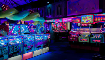 a arcade game room with arcade machines