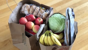 a group of grocery bags with food