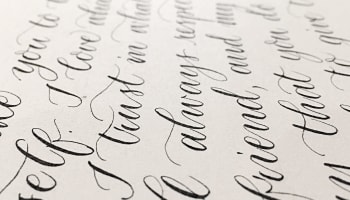 a close up of a paper with calligraphy