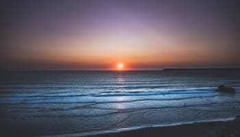 a sunset over a beach