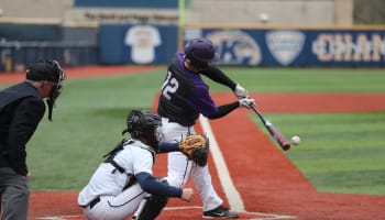 a baseball player swinging a bat