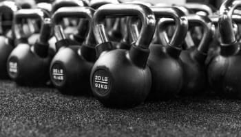 a group of kettlebells on a floor