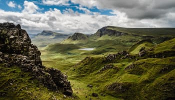 green hills with rocks