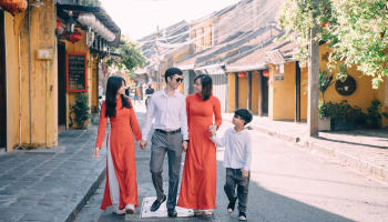 a group of people walking on a street