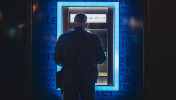 a person standing in front of a machine