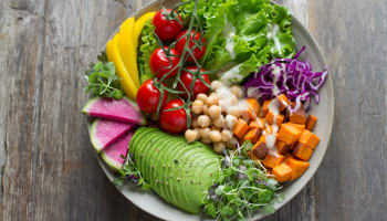 a bowl of food on a wood surface