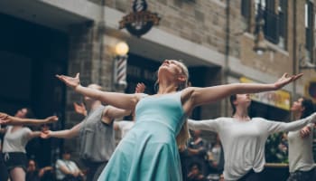 a group of people dancing in a building