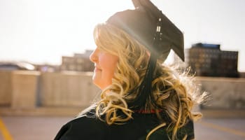 a person in a graduation cap and gown