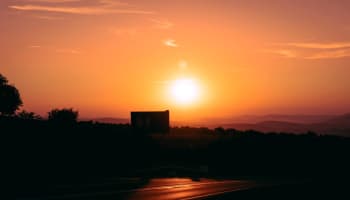 a sunset over a road