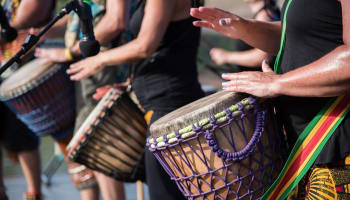 a group of people playing drums