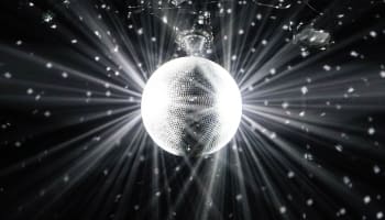 a disco ball with light rays