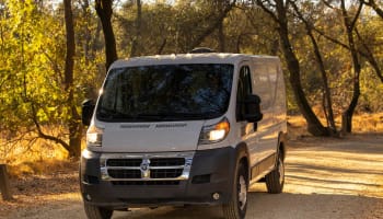 a white van on a dirt road
