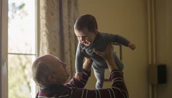 a person holding a baby