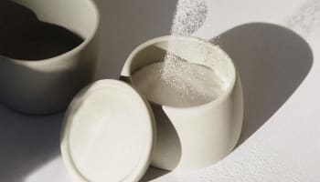 a salt being poured into a container