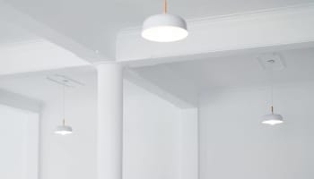 a white ceiling with a light fixture