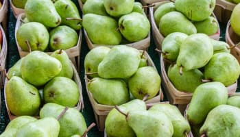 a group of baskets of pears