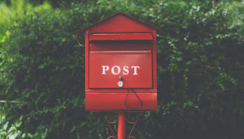 a red mailbox with white text