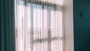 a window with white curtains