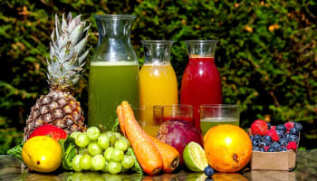 a group of juices and fruits