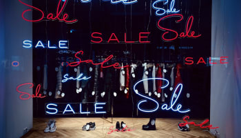 a display of a store with neon signs