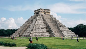 a pyramid in a grassy area