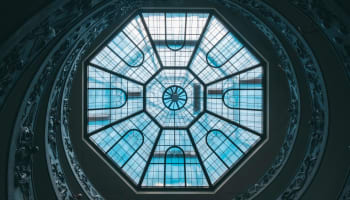 a glass ceiling with a circular design