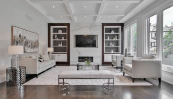 a living room with a TV and a fireplace