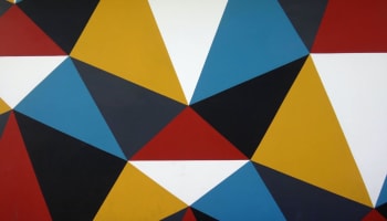 a colorful triangle pattern on a surface