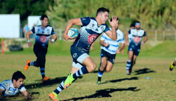 a group of men playing rugby