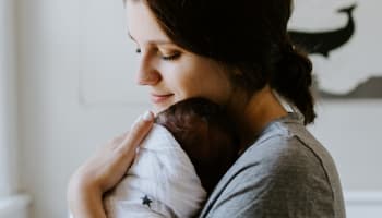 a person holding a baby
