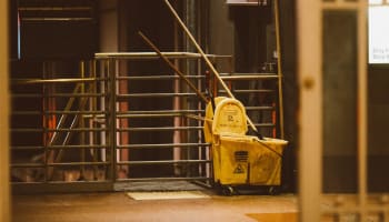 a mop and bucket in a room