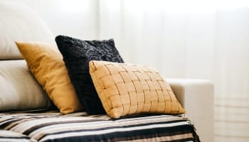 a group of pillows on a couch