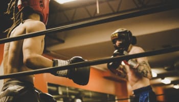 a group of men boxing in a ring