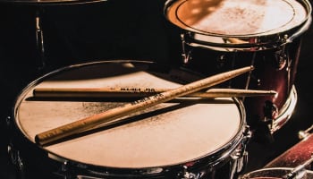a drum set with drumsticks