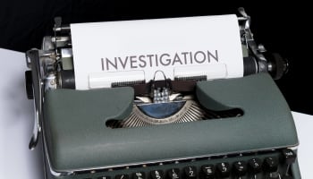 a typewriter with a piece of paper