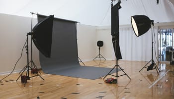 a photo studio with a large screen