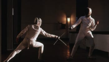 two people in fencing gear