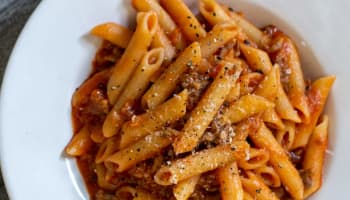 a plate of pasta with sauce