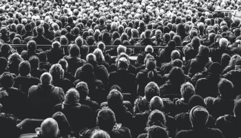 a large crowd of people in a room